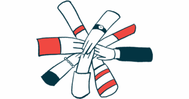 A group of people's hands on top of one another in a circle.