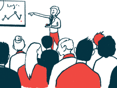 A speaker points to longitudinal data on a whiteboard while giving a presentation.