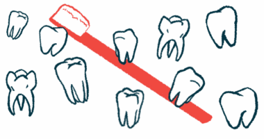 Several teeth of different shapes and sizes float in front of a large red toothbrush