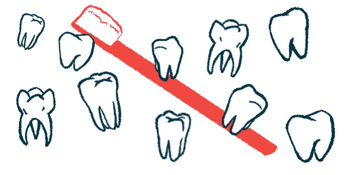 Several teeth of different shapes and sizes float in front of a large red toothbrush